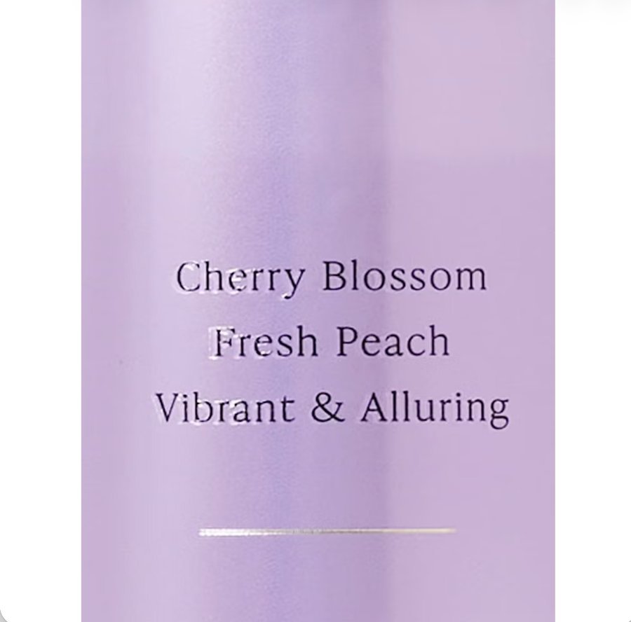 Love Spell body mist label showing cherry blossom, fresh peach, vibrant and alluring notes