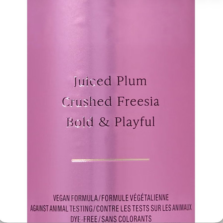 Victoria's Secret Pure Seduction mist label showing juiced plum, crushed freesia, bold and playful vegan formula